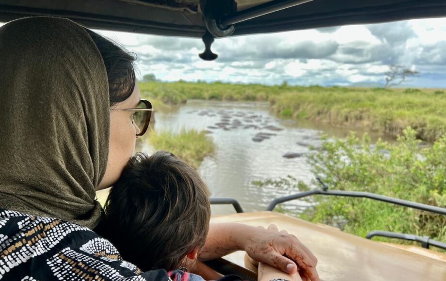 A mother with her child in a safari jeep in kenya